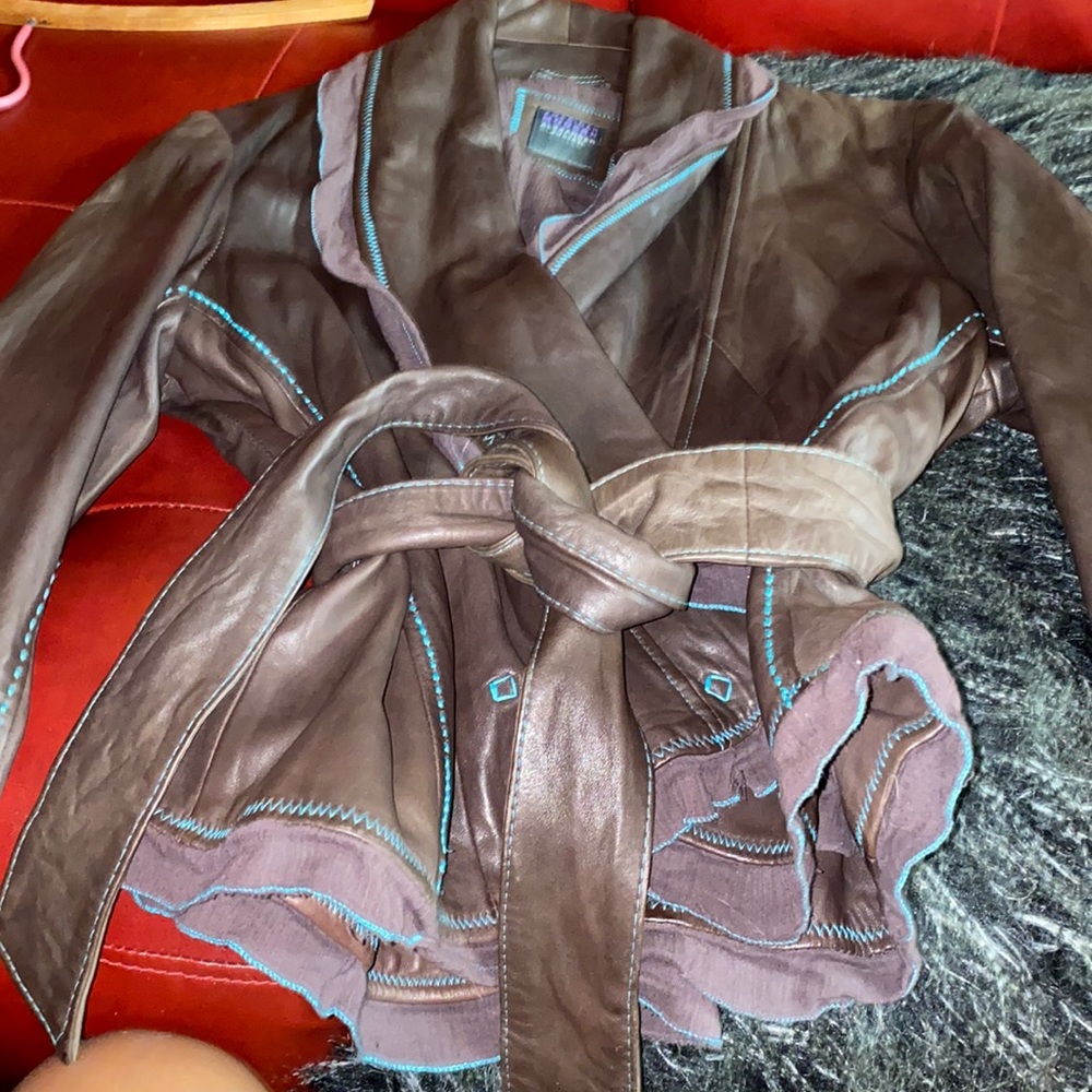 Brown butter soft leather with turquoise piping! Warn twice!Excellent condition!